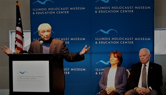 Holocaust survivors Aaron Elster, speaking, Fritzie Fritzshall and Ralph Rehbock at Illunois Holocaust Museum & Education Center. Feb 2. 2017. Source: Jonah Meadows / Patch.com / Donald Trump Refugee Ban Condemned By Chicago-Area Holocaust Survivors